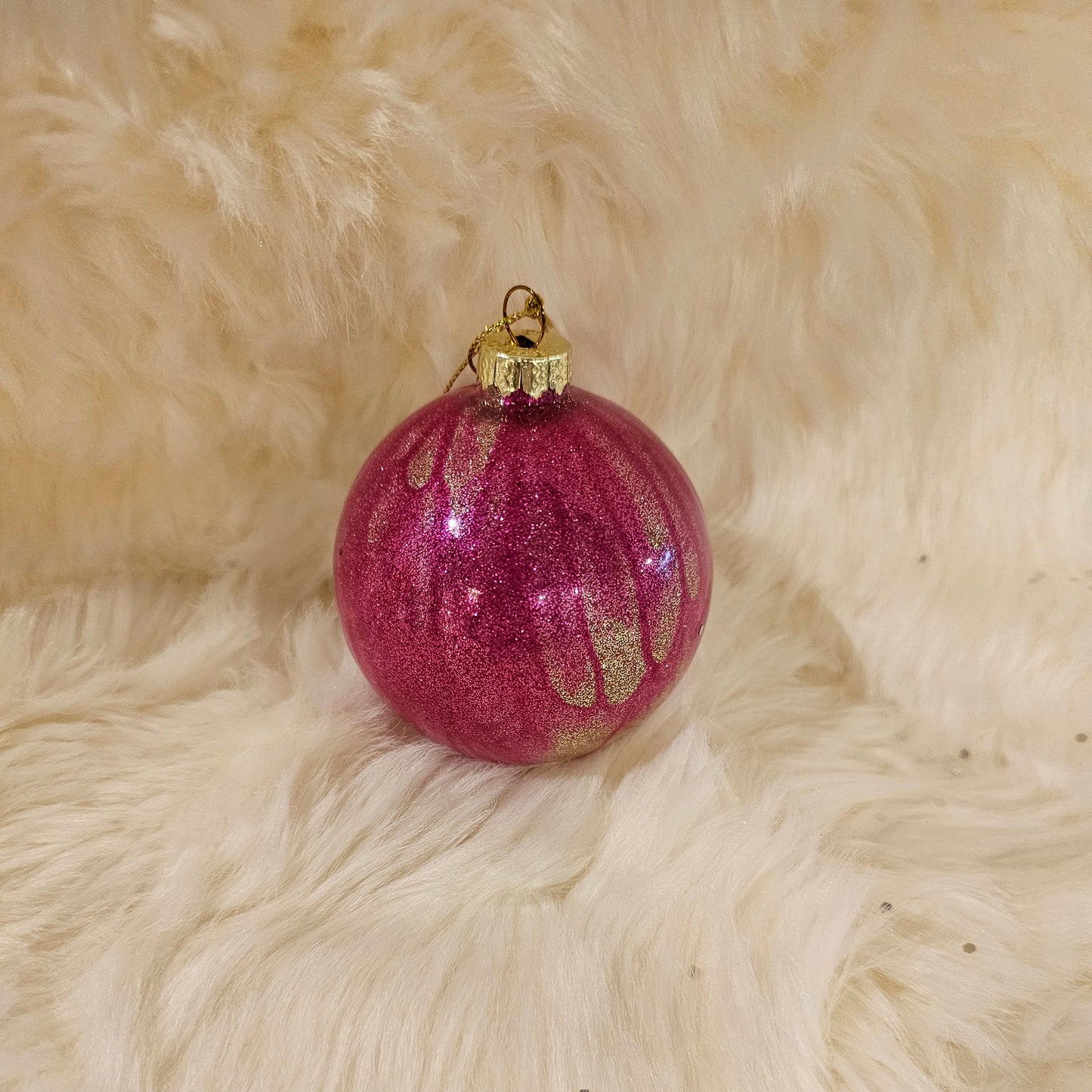 Pink ornament with gold accents